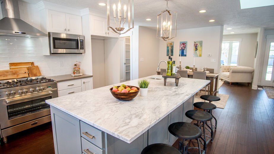 New kitchen remodel completed by AZ1 Builders in Goodyear, AZ featuring modern cabinets, quartz countertops, and upgraded lighting.